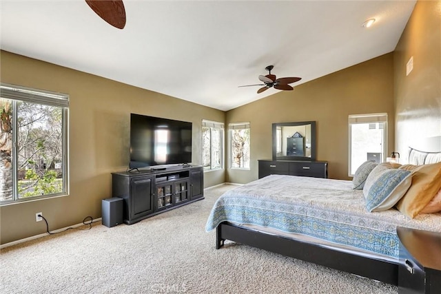 carpeted bedroom featuring a ceiling fan, baseboards, and lofted ceiling