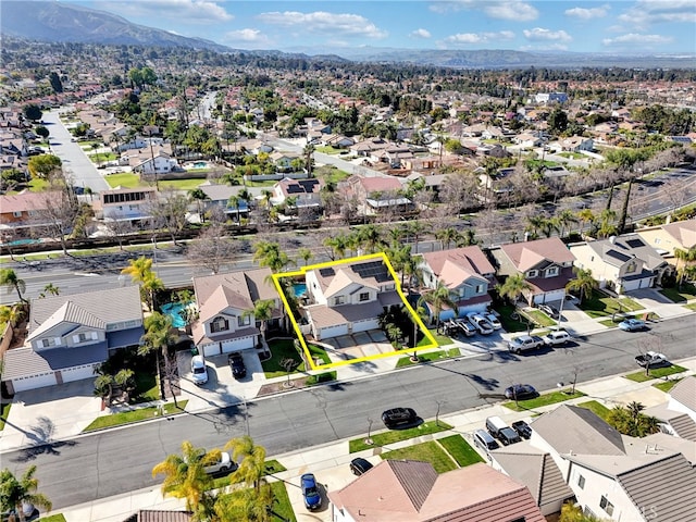 birds eye view of property with a residential view and a mountain view