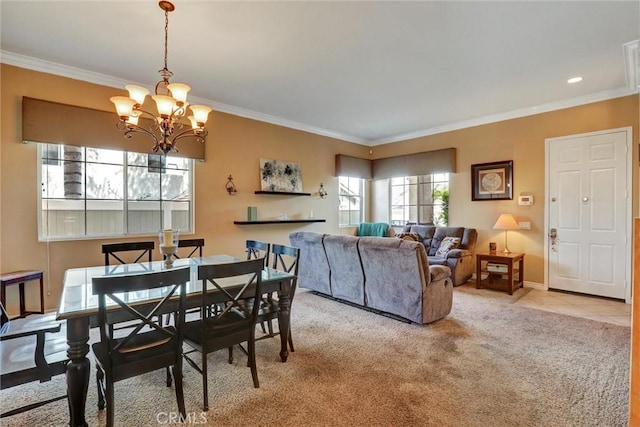 dining area featuring baseboards, a chandelier, ornamental molding, light carpet, and recessed lighting