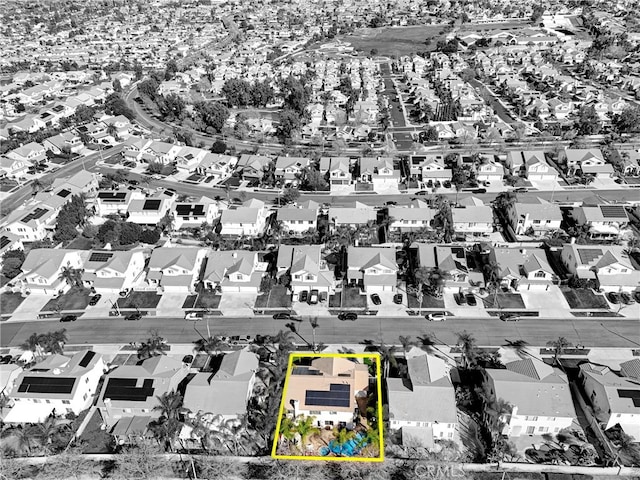 birds eye view of property with a residential view