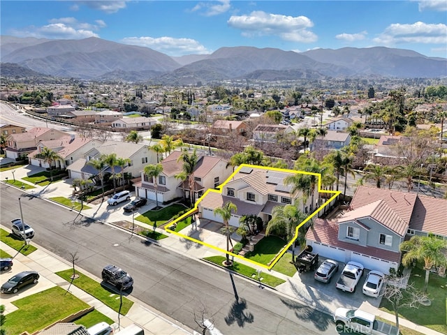birds eye view of property with a residential view and a mountain view