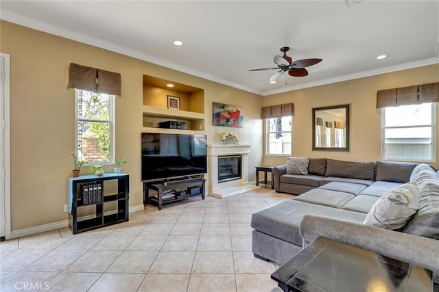 living area featuring ornamental molding, built in features, light tile patterned flooring, recessed lighting, and a ceiling fan