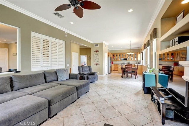 living room with recessed lighting, visible vents, light tile patterned floors, and ceiling fan with notable chandelier