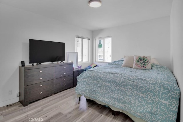 bedroom with wood finished floors