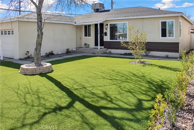 ranch-style home with a front lawn, central AC, an attached garage, and stucco siding