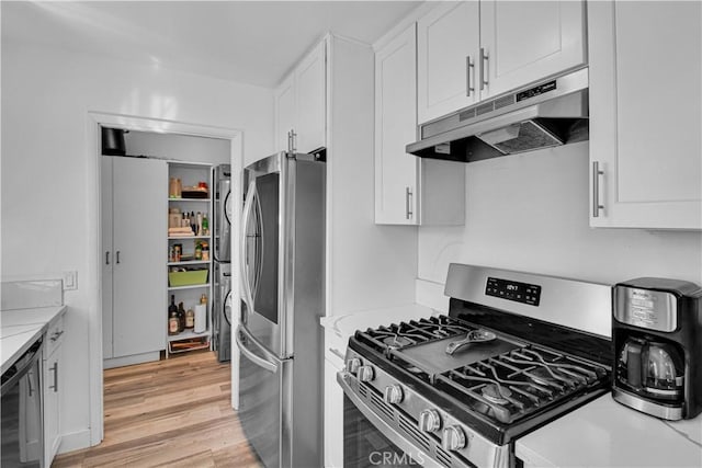 kitchen featuring white cabinetry, stainless steel appliances, under cabinet range hood, light wood finished floors, and wine cooler