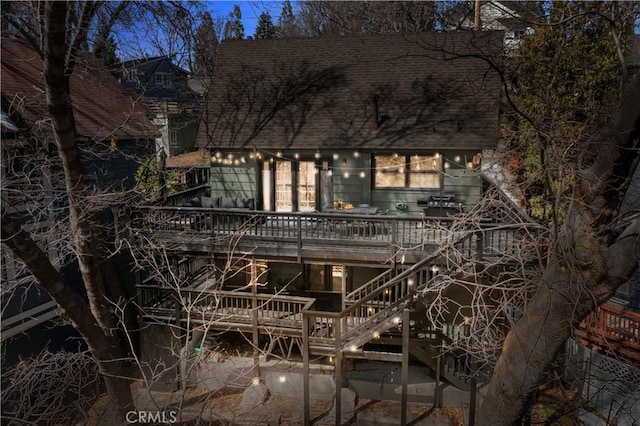 28886 Cedar Dr, Lake Arrowhead, CA 92352 - view of front of property featuring a shingled roof, a deck, and stairway