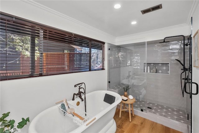 28886 Cedar Dr, Lake Arrowhead, CA 92352 - full bath with a stall shower, ornamental molding, a freestanding bath, recessed lighting, and wood finished floors