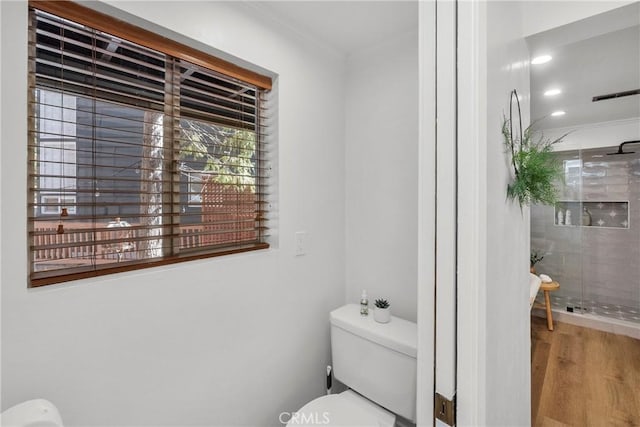 28886 Cedar Dr, Lake Arrowhead, CA 92352 - bathroom featuring toilet, wood finished floors, ornamental molding, and a tile shower