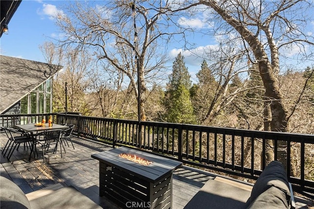 28886 Cedar Dr, Lake Arrowhead, CA 92352 - wooden deck with outdoor dining area and an outdoor fire pit