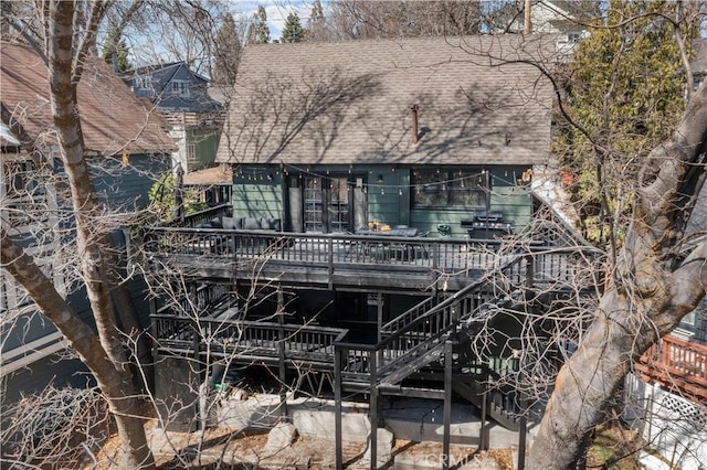 28886 Cedar Dr, Lake Arrowhead, CA 92352 - view of front facade with roof with shingles, a deck, and stairway