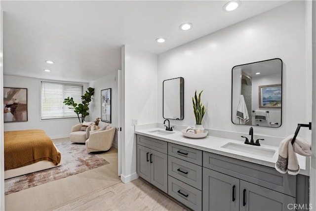 5301 Balboa Blvd Unit M4, Encino, CA 91316 - bathroom with double vanity, ensuite bath, recessed lighting, and baseboards