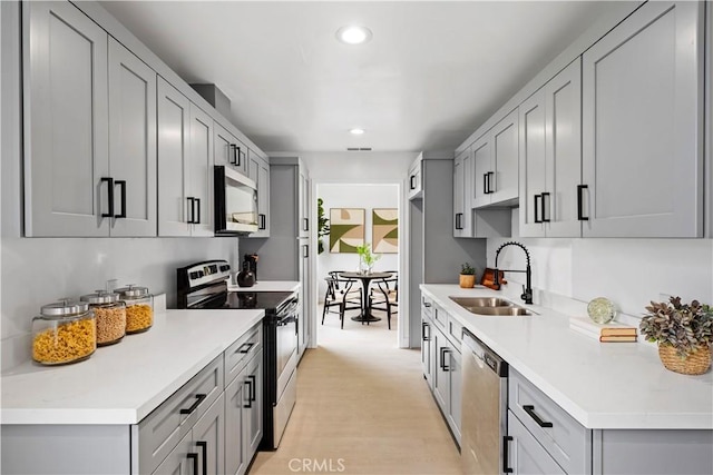 5301 Balboa Blvd Unit M4, Encino, CA 91316 - kitchen with appliances with stainless steel finishes, a sink, gray cabinetry, recessed lighting, and light countertops
