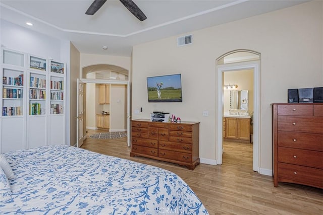 bedroom with visible vents, baseboards, light wood-style floors, recessed lighting, and connected bathroom