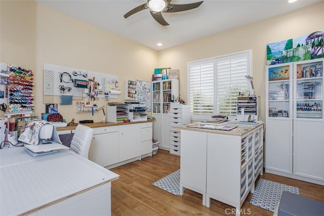 kitchen featuring recessed lighting, light wood finished floors, white cabinetry, and a ceiling fan