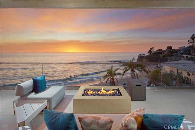 13 Lagunita Dr, Laguna Beach, CA 92651 - patio terrace at dusk with an outdoor living space with a fire pit, a view of the beach, and a water view