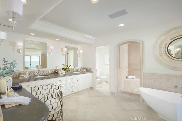 13 Lagunita Dr, Laguna Beach, CA 92651 - full bath with toilet, double vanity, recessed lighting, a freestanding tub, and a sink