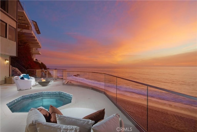 13 Lagunita Dr, Laguna Beach, CA 92651 - pool at dusk with a water view, a patio, and an outdoor fire pit