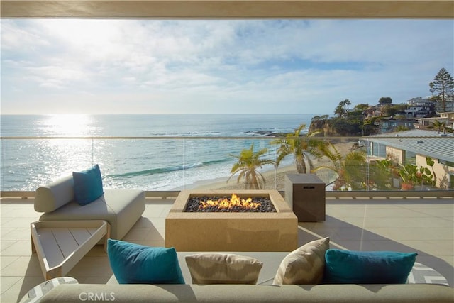 13 Lagunita Dr, Laguna Beach, CA 92651 - view of patio with an outdoor living space with a fire pit and a water view