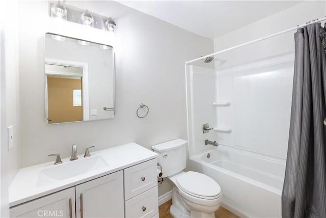 full bath featuring shower / tub combo with curtain, toilet, and vanity