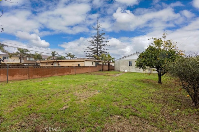 view of yard with fence