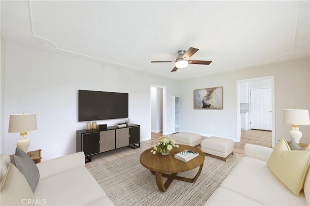 living area with light wood-style floors and ceiling fan