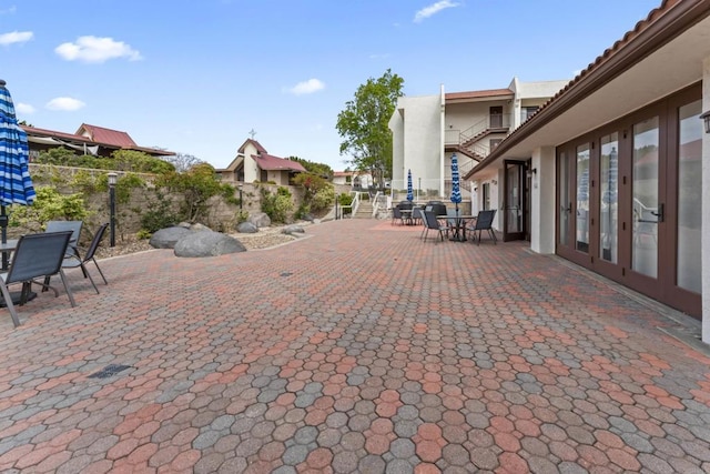 6330 Genesee Ave Unit 119, San Diego, CA 92122 - view of patio / terrace with outdoor dining area and fence