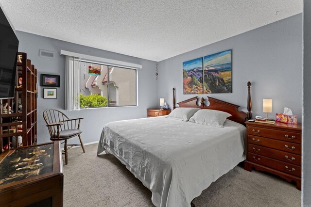 6330 Genesee Ave Unit 119, San Diego, CA 92122 - carpeted bedroom featuring a textured ceiling