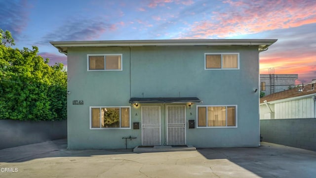 544 Salem St, Glendale, CA 91203 - back of house at dusk featuring stucco siding and fence