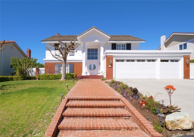 49 Country Ln, Rolling Hills Estates, CA 90274 - traditional home with a front lawn, an attached garage, brick siding, and concrete driveway