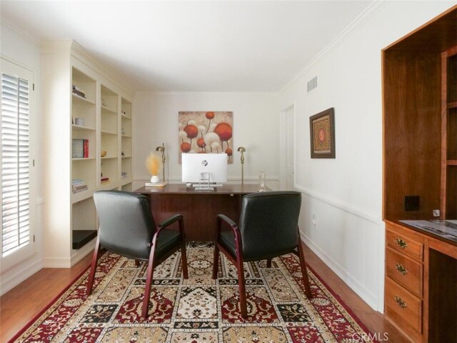 49 Country Ln, Rolling Hills Estates, CA 90274 - office area featuring a wainscoted wall, visible vents, wood finished floors, and ornamental molding