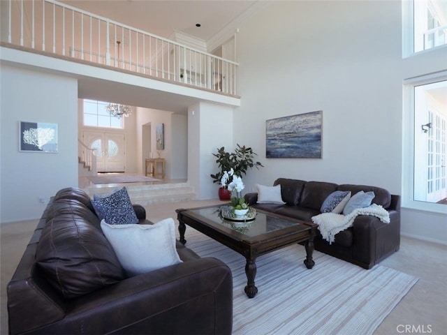 49 Country Ln, Rolling Hills Estates, CA 90274 - carpeted living room with plenty of natural light, a towering ceiling, and a chandelier