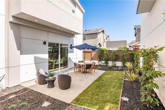 view of patio featuring fence