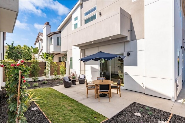 view of patio featuring fence