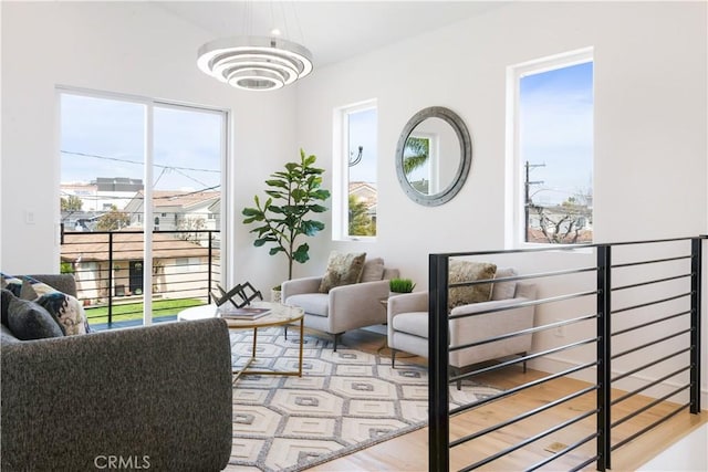 interior space with an inviting chandelier and wood finished floors