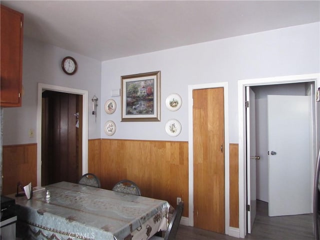 2956 W 15th St, Los Angeles, CA 90006 - dining room with a wainscoted wall, wood walls, and wood finished floors
