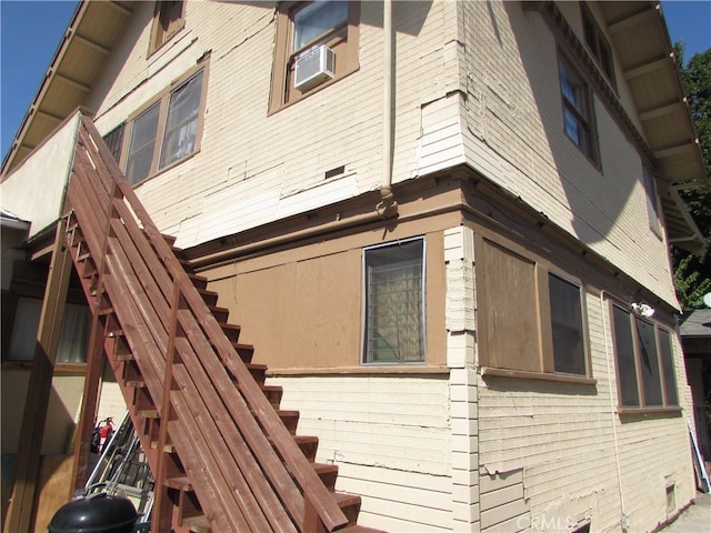 2956 W 15th St, Los Angeles, CA 90006 - view of side of home featuring cooling unit and stairway