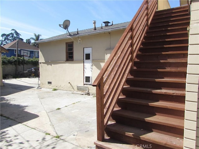 2956 W 15th St, Los Angeles, CA 90006 - rear view of house featuring stairs, a patio, and stucco siding