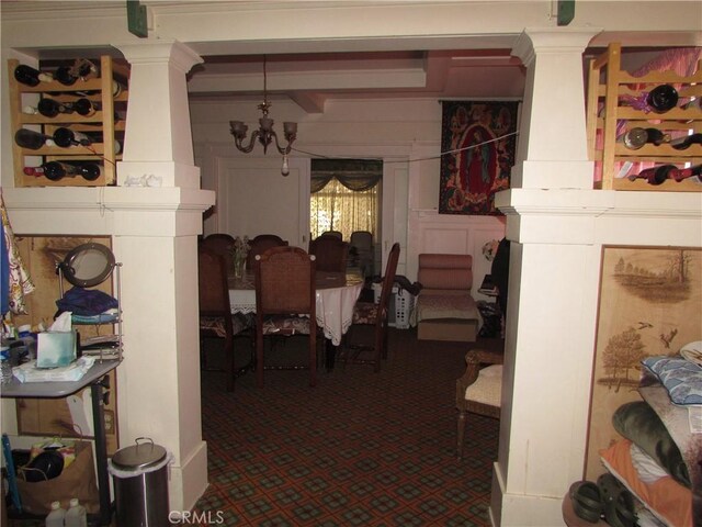 2956 W 15th St, Los Angeles, CA 90006 - dining room with beam ceiling, decorative columns, and a notable chandelier