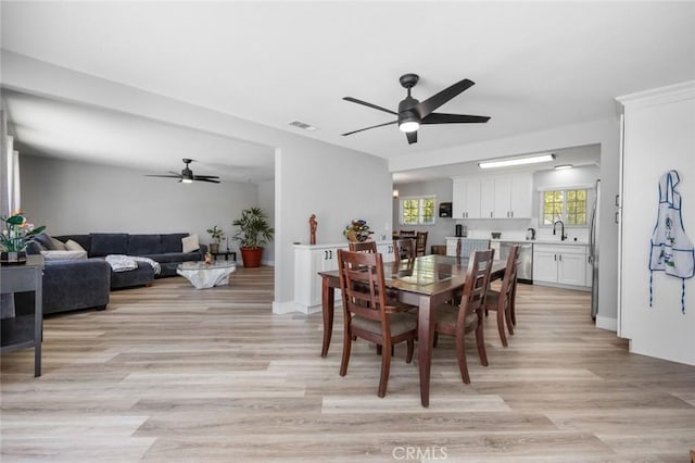 11911 Ivy Ln, Moreno Valley, CA 92557 - dining room with a ceiling fan and light wood finished floors