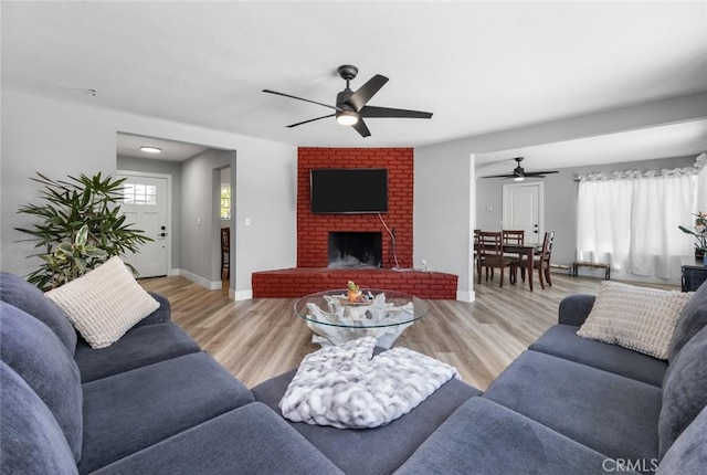 11911 Ivy Ln, Moreno Valley, CA 92557 - living area with ceiling fan, wood finished floors, and baseboards