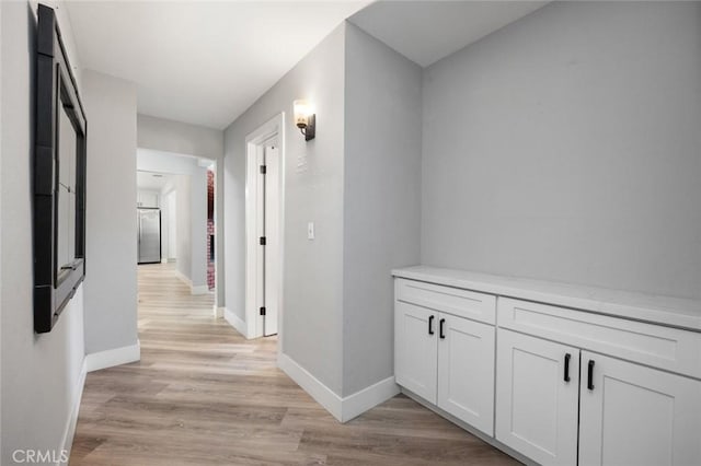 11911 Ivy Ln, Moreno Valley, CA 92557 - hallway featuring baseboards and light wood-style floors