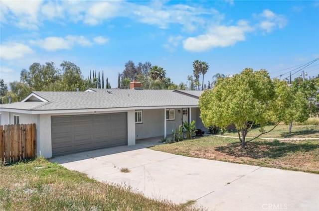 11911 Ivy Ln, Moreno Valley, CA 92557 - single story home with an attached garage, fence, concrete driveway, stucco siding, and roof with shingles