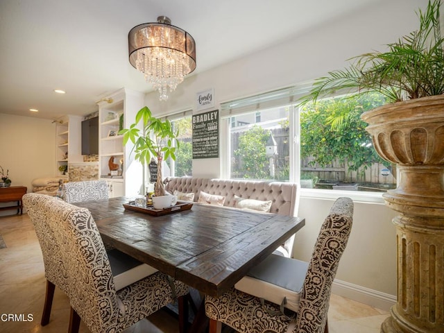 dining area with recessed lighting, an inviting chandelier, and light tile patterned flooring