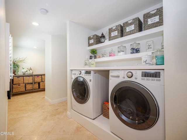 laundry room with baseboards, light tile patterned floors, laundry area, recessed lighting, and washer and dryer