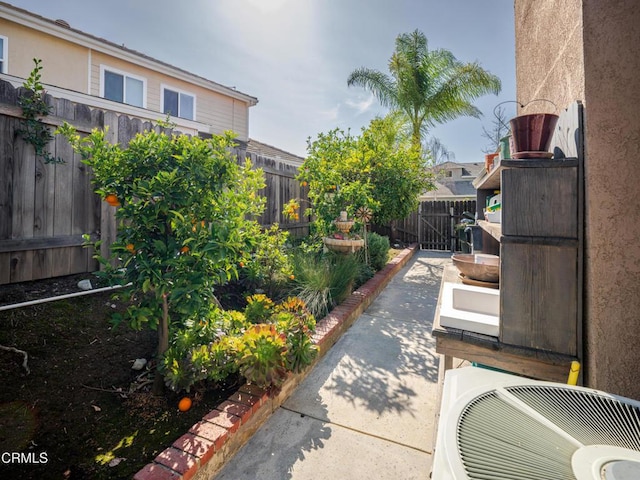 view of patio / terrace featuring a fenced backyard and ac unit