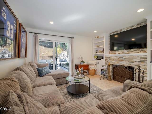 living area featuring built in features, recessed lighting, and a fireplace