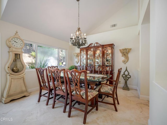 dining area with a notable chandelier, baseboards, visible vents, and high vaulted ceiling