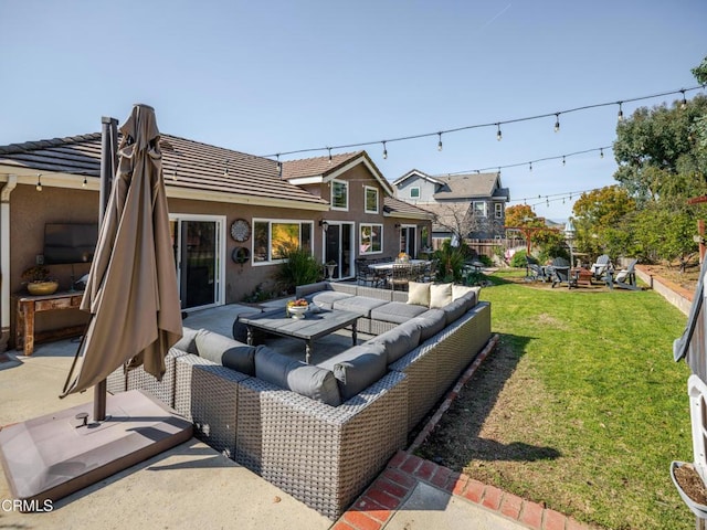 view of patio / terrace with an outdoor living space with a fire pit and fence
