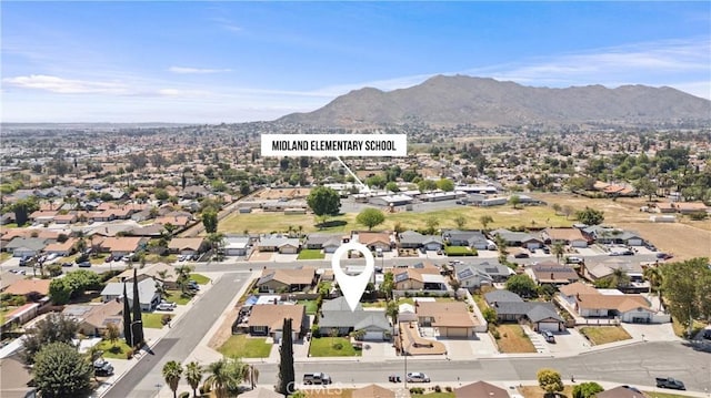 drone / aerial view featuring a mountain view and a residential view